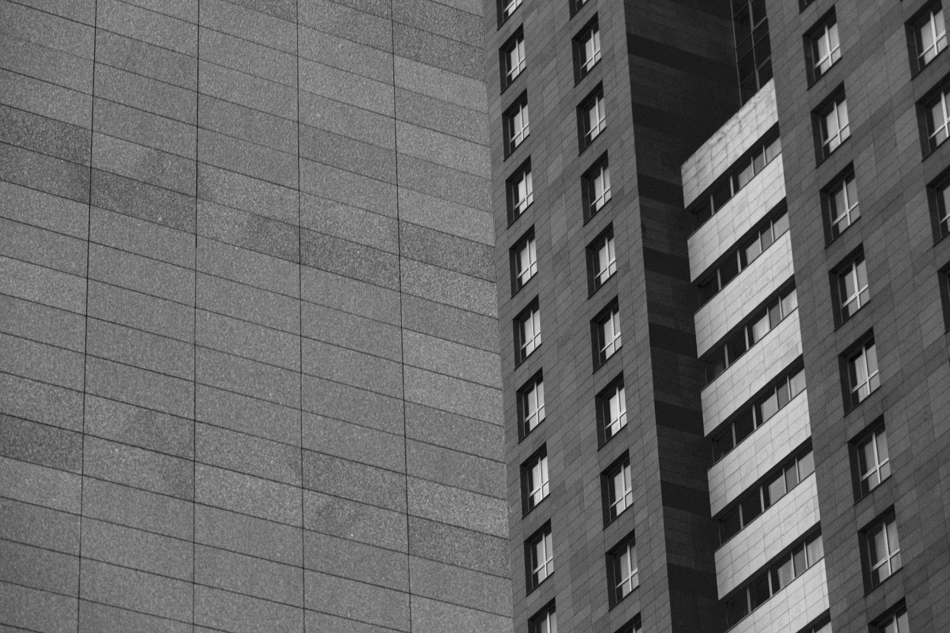 Modern high-rise buildings with grid-like facades.
